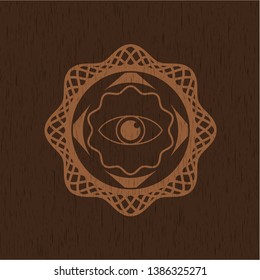 eye icon inside badge with wood background