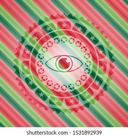 eye icon inside christmas badge.