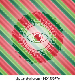 eye icon inside christmas emblem.