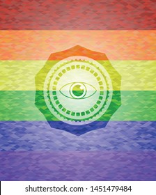 eye icon inside emblem on mosaic background with the colors of the LGBT flag