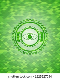 eye icon inside green emblem with triangle mosaic background