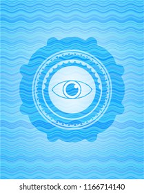 eye icon inside light blue water wave badge background.