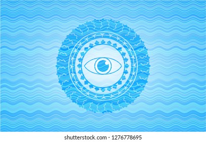 eye icon inside light blue water wave badge.