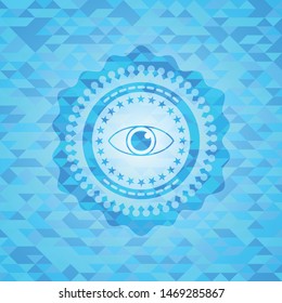eye icon inside light blue emblem with triangle mosaic background