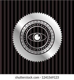 eye icon inside silver emblem or badge