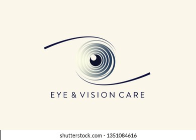 Eye logo for ophthalmology office.Medical icon for vision care.Blue ring-shaped iris with pupil in the center.Circular sign isolated on light background.Ocular, optic symbol.