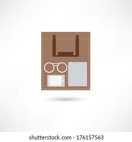 eyeglasses, e-book and sheet of paper inside the paper bag