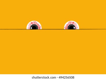 Eyes of devil looking from the letter with space for note on Halloween background