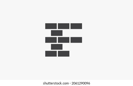 F concepto de logotipo de letra de ladrillo aislado en fondo blanco.