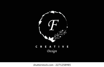 F letter logo in white water color on black background Vector abstract design element