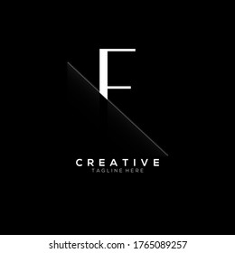 F White Letter Logo Design with Creative Paper Cut