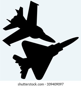 An F-18 jet fighters flying in the sky. Isolated on blue background. Vector silhouettes