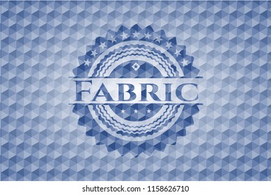 Fabric blue badge with geometric pattern background.