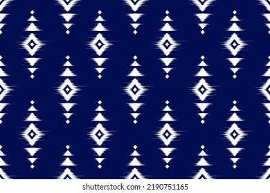 Fabric ethnic ikat art. Seamless pattern in tribal. Aztec geometric ornament print. Design for background, wallpaper, illustration, fabric, clothing, carpet, textile, batik, embroidery.