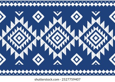 Fabric ikat abstract geometric pattern on blue background. Design for clothing, fabric, background, wallpaper, wrapping, batik. Knitwear, Embroidery style. Aztec geometric art ornament