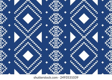 Fabric pixel abstract geometric pattern on blue background. Design for clothing, fabric, background, wallpaper, wrapping, batik. Knitwear, Embroidery style. Aztec geometric art ornament
