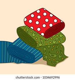 Fabric rolls with the different drawing. Are laid out in a pile.