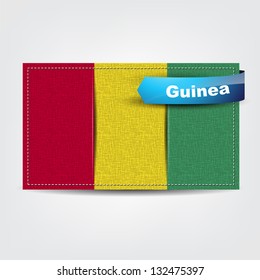 Fabric texture of the flag of Guinea with a blue bow. (Vector EPS10)