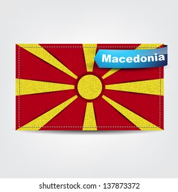 Fabric texture of the flag of Macedonia with a blue bow. (Vector EPS10)