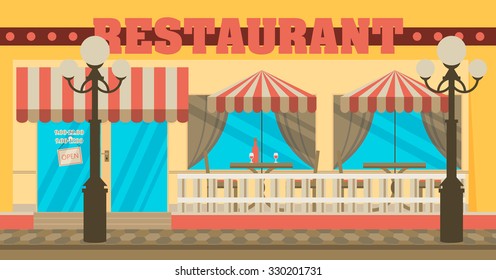 The facade of the cafe with umbrellas, chairs, tables