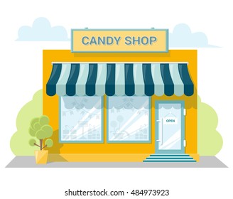 Facade candy store with a signboard, awning and products in shopwindow. Abstract image in a flat design. Front shop for concept brochure or banner. Vector illustration isolated on white background