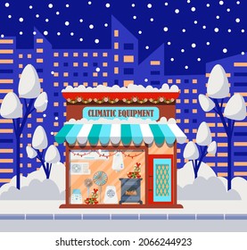 La fachada de la tienda de equipos climáticos está decorada para Navidad.  Mostrador acogedor decorado e iluminado con cajas de regalo, guirnaldas, corona navideña en la puerta. Calle de invierno con fachada de tienda.