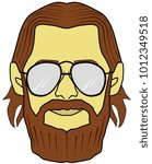 the face of a bearded man with glasses