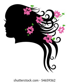 Face of beautiful girl with delicate flowers in her hair