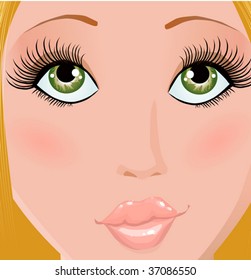 The face of the beautiful young blonde with green eyes