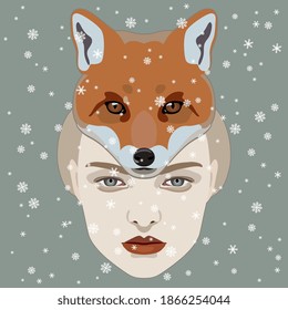 Face of a beautiful young woman in fox hat or mask under snowflakes. Creative winter concept.