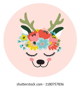 The face of a cute deer, a wreath of flowers on his head. Eyes closed and smiling. Vector illustration on a pink background.