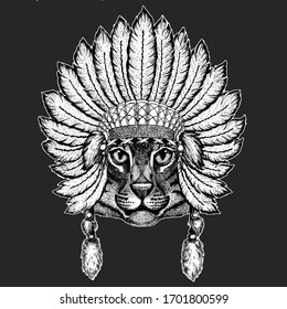 Face of domestic cat. Indian tribal traditional headdress with feathers. Portrait of animal. Cute kitty, kitten.
