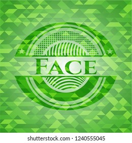 Face green emblem with triangle mosaic background
