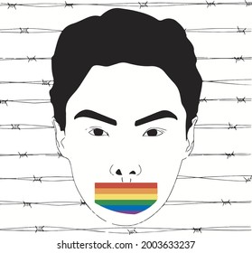 The face of a man with his mouth sealed with pride flag color tape against the background of prickly wires. LGBT and LGBTQ concept. Equal rights for all