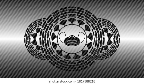 Face mask icon inside carbon fiber dark realistic emblem. Polymer texture graceful background. Illustration. 
