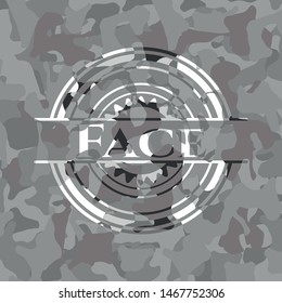 Face on grey camouflage texture