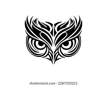 ﻿A face of an owl with striking black and white Polynesian patterns tattooed on it.