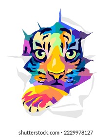 Face of a tiger cub in a paper hole,pop art style