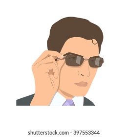 Face of a young man in sunglasses.  Businessman rearranging brown spectacles.