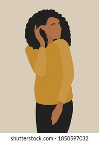 Faceless portrait of a young african-american female with curly hair wearing a yellow sweater and dark jeans