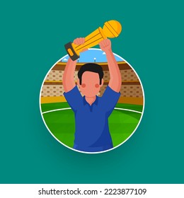 Faceless Winner Cricket Player Holding Trophy Cup On Stadium Green Background.