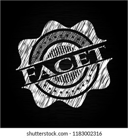 Facet chalk emblem written on a blackboard