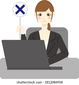Facial expression of a female office worker with a personal computer. Cross mark