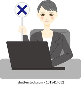 Facial expression of a female office worker with a personal computer. Cross mark