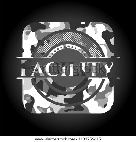 Facility written on a grey camouflage texture