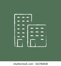 Factory hand drawn in chalk on a blackboard vector white icon isolated on a green background.
