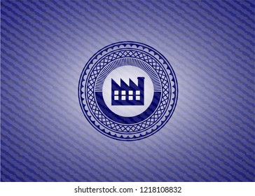 factory icon inside badge with denim background