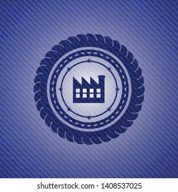 factory icon inside badge with denim texture