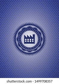 factory icon inside badge with denim background