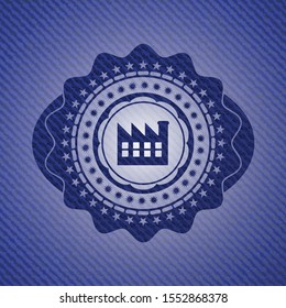 factory icon inside badge with denim background